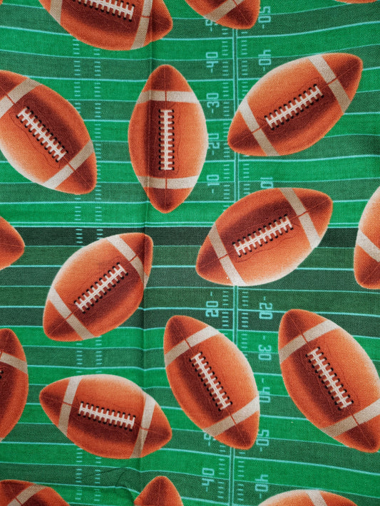 Large Footballs on Field Cotton Fabric