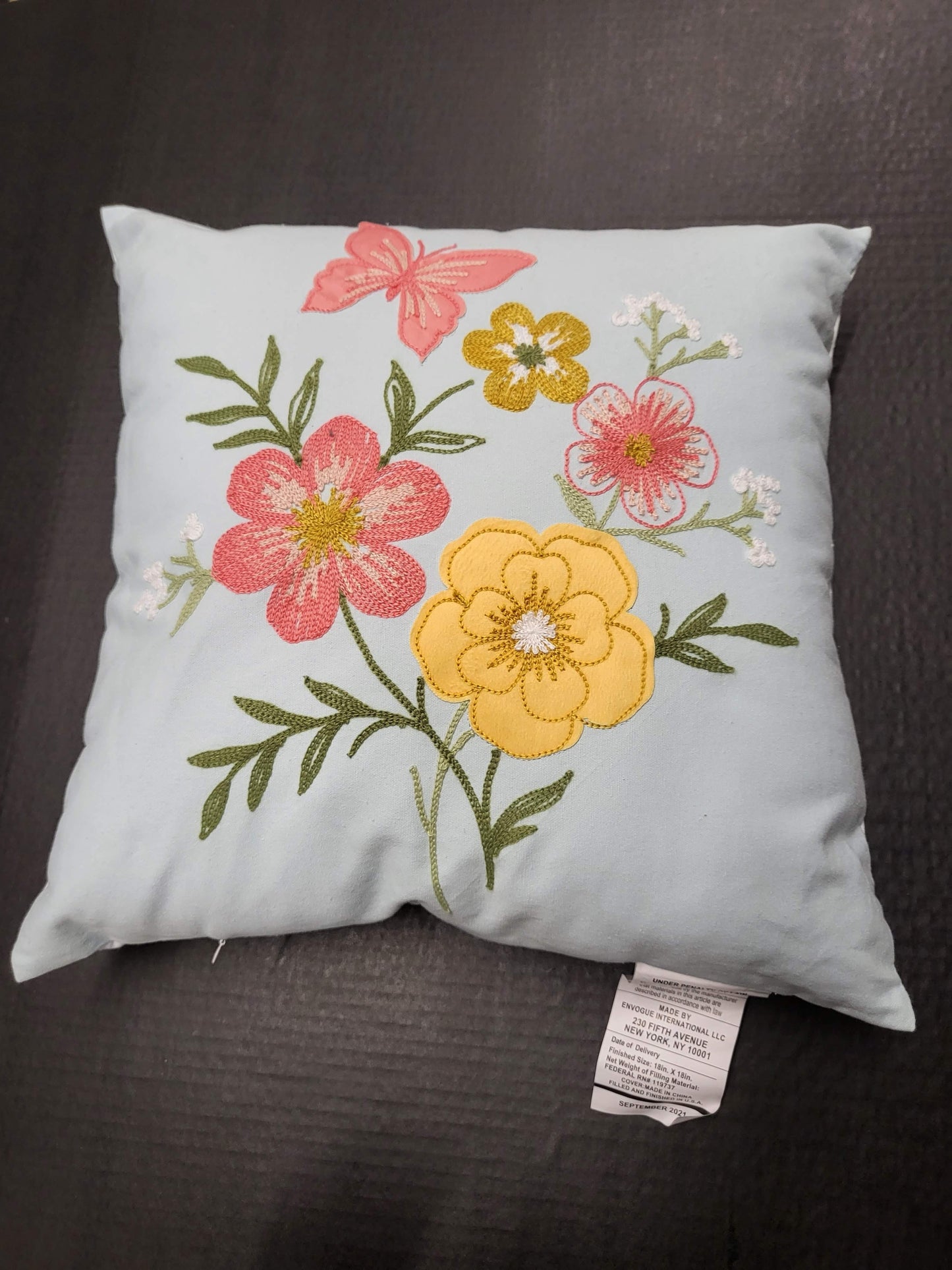 Spring Throw Pillows with Pink and Yellow Flowers and Butterfly on Light Blue